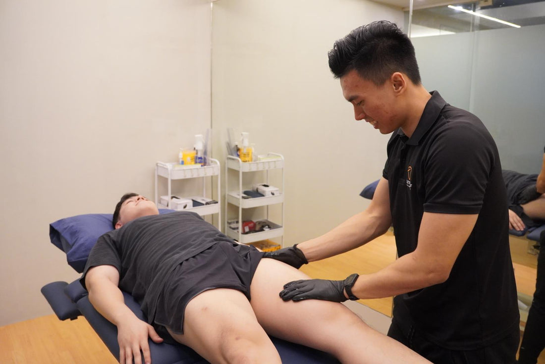 A Movement Specialist treating an athlete at the Bulletproof Movement Institute in Quezon City