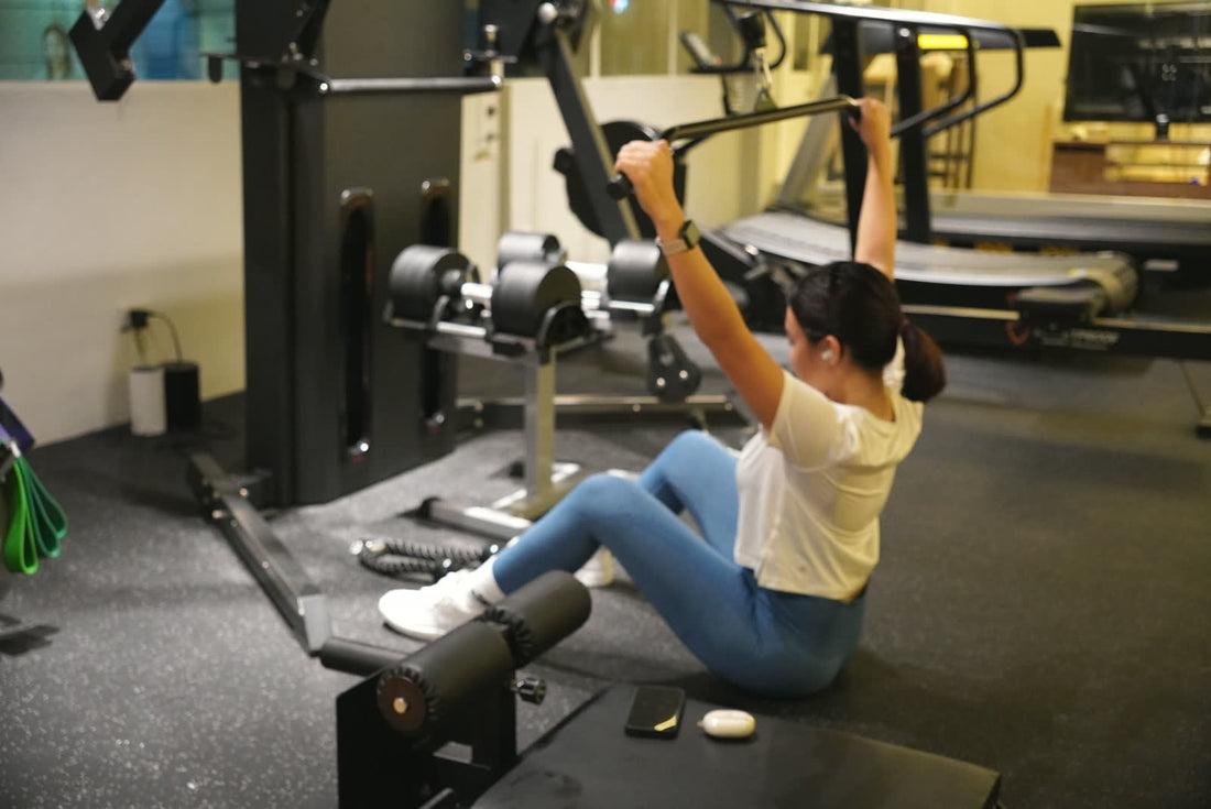 A client training on the cable machine at the Bulletproof clinic